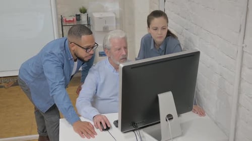 Multiracial People Working on Computer in Office