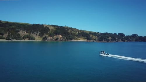 Aerial drone 4k cinematic footage. Flying above speed boat on the blue sea. sideways over fast movin