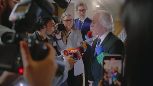 Speaker Answering Questions from Reporters at Press Conference