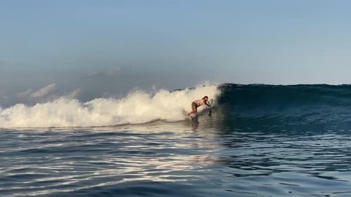 Young Man Surfing in the Ocean
