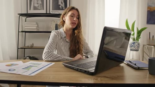Businesswoman Works at the Computer From Home in Pajamas