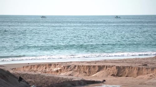 Fishing boats speeding in the open sea.
Crystal beach water. Portugal