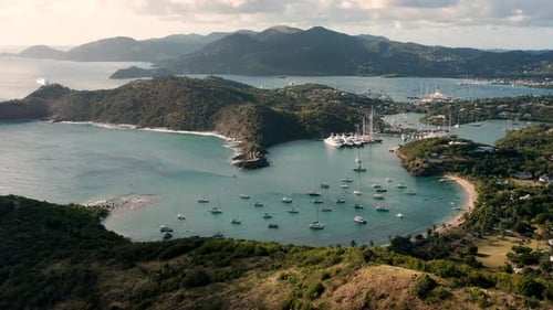 Sunny aerial shot of English Harbor in Antigua, Caribbean with views of yachts, sailboats, marina, b