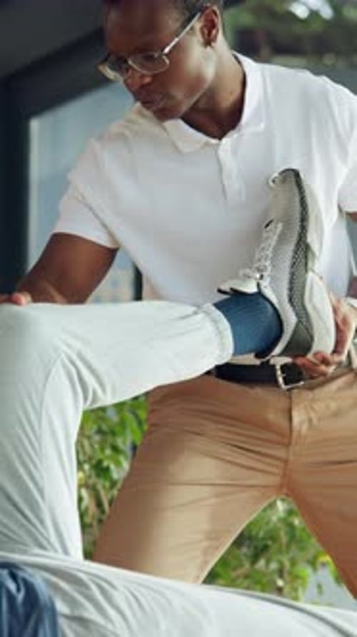 Physiotherapy, knee exercise and physiotherapist with person in office for muscle mobility