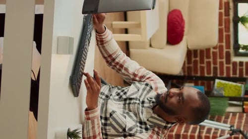 Vertical Video African American Man Working on Computer at Desk