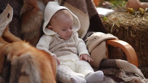 Content Infant Sitting on Chair with Rustic Decor