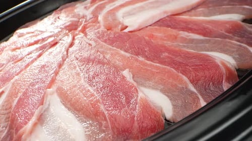 Macro video of raw pork belly slice