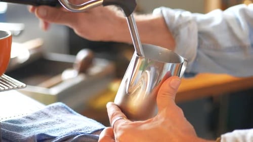Man Preparing Coffee in Cafe with Espresso Machine