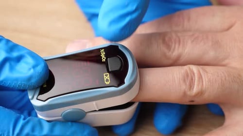 Oximeter Measures Blood Oxygen Levels on Finger