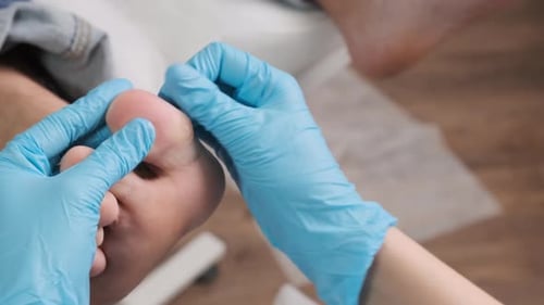 Close Up Pedologist Doing Foot Massage to Woman