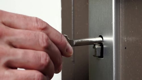 Skeleton Key Going Into Old Keyhole Lock