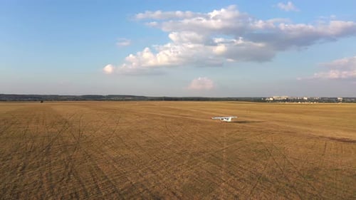 Small Airplane Riding Along Rural Runway Before the Takeoff