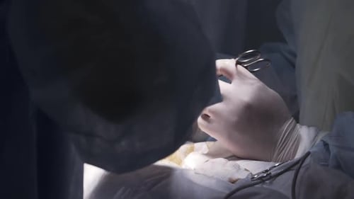 Surgeons Operating in a Hospital Operating Room