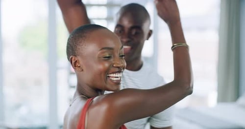 Happy Young Couple Dancing Together Indoors