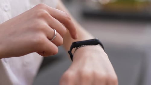 Woman Using Smart Watch Device on Wrist