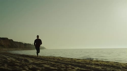 Athlete Girl Sprint at Sunrise Outdoors. Unrecognizable Woman Running Sandy Beach In