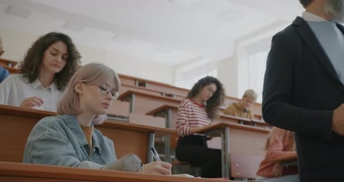 Students Attending Lecture in Bright Classroom