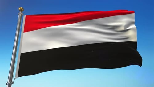Realistic Yemen Flag Waving on Flagpole Against Blue Sky