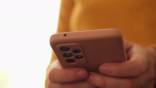 Smartphone Use, Close Up on Pink Cell Phone