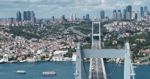 Istanbul Bosphorus Bridge and City Skyline in Background with Turkish Flag at Beautiful Sunset