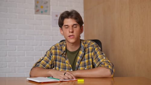 Man College Student Studying at Home Pov Sitting at Desk Listening Watching Lesson Online on