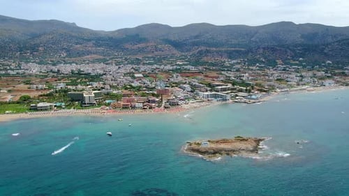 Aerial panorama on blue mediterranean sea and Greece resort town, Crete