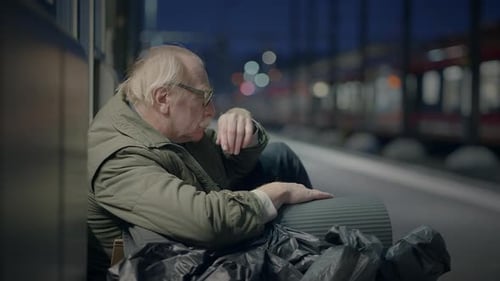 Elderly Homeless Man Suffering From Poverty Looking for Help at Train Station
