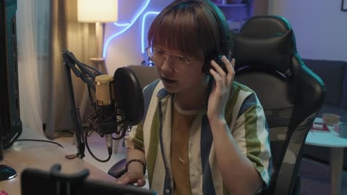 Young Adult Streaming in Urban Home at Night