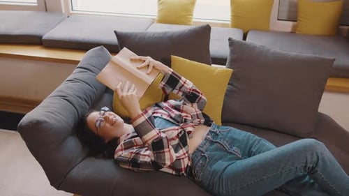 Full Body Young Smiling Happy Smart College Student Girl Wear Green Casual Clothes Sit in Chair