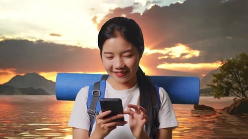 Close Up Of Asian Female Hiker Enjoy Using Smartphone At A Lake