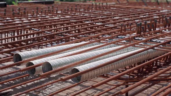 Metal reinforcing bars or rebar on a construction site waiting for the ...