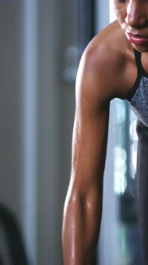Fitness, gym and black woman with dumbbell for exercise, bodybuilder training and muscle workout