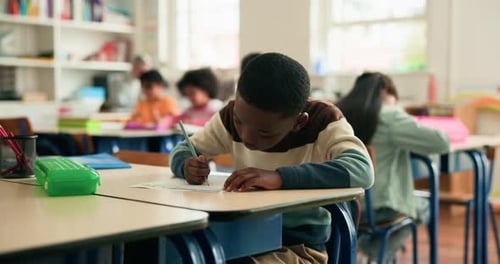Learning, writing and kid in classroom at school for test, assessment or project for education
