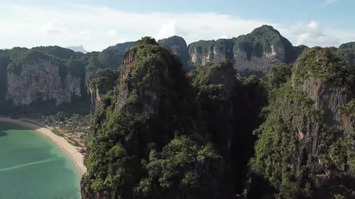 Tropical Paradise of Thailand Islands. Cinematic Aerial View of Steep Limestone Ridges Over White Sa