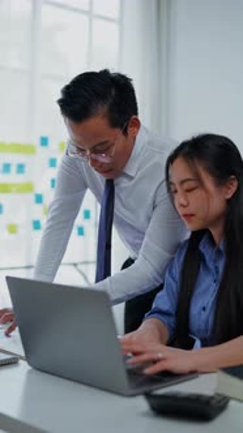 Collaborative Business Team Working on Laptop