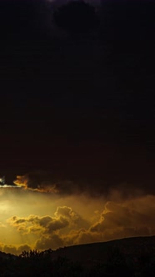 Golden Hour Clouds Over Mountain Range Time Lapse