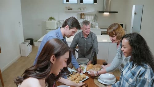 Friends and Family Gather for Dinner at Home