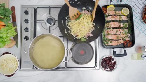 Overhead shot of Cooking Spaghetti and Salmon