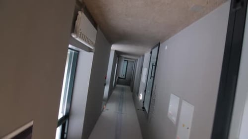 Empty Corridor with Closed Classroom Doors in School