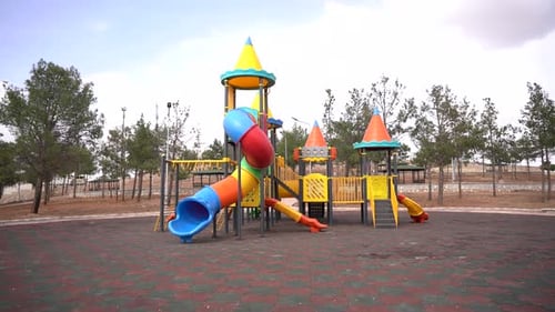 Colorful children's playground in the middle of the forestation area