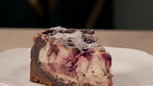 A dessert close-up of a piece of delicious cake lying on a white plate in an Italian restaurant