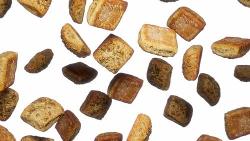 Seamless Loop of Falling Baked Bread Pieces with Seeds