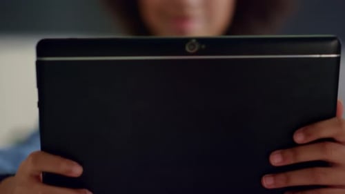 Close Up of Smiling Child Studying in School with Tablet Computer. African