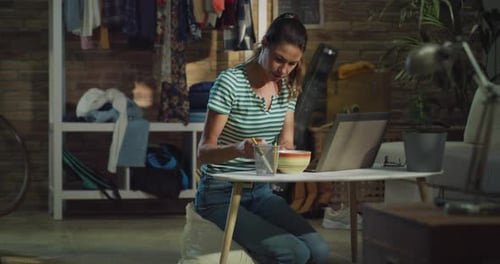 Woman Works at Laptop From Home on Floor