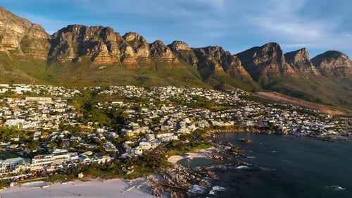 Aerial view of coastal city with beaches and mountains, South Africa.