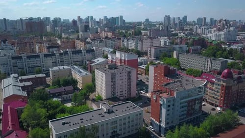 A summer sunny city taken from a bird's-eye view. Clip. A small provincial town in the summer