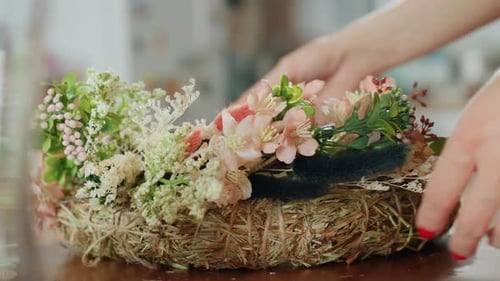Close Up Florist Arranging Handmade Floral Wreath Decorated