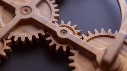 Animación en bucle de una construcción mecánica hecha de engranajes de madera.