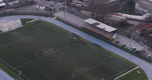 Aerial view of soccer field and bleachers, Italy.