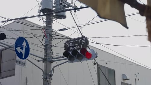 Honcho 2 intersection traffic light and tangled power lines in Japan